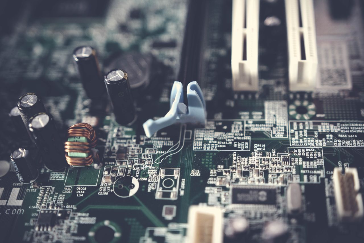 about-02 Detailed view of components on a computer motherboard, showcasing technology and circuitry.