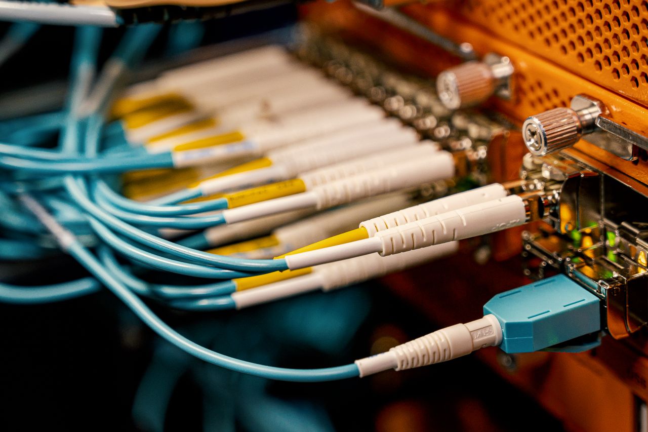 about-01 From above of optical switch equipment with many similar connectors with rubber cables and metal parts